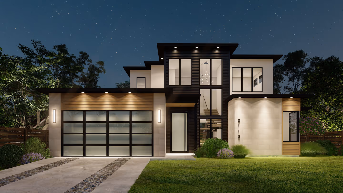 Modern two-story house at night with large windows, illuminated garage, and landscaped front yard.