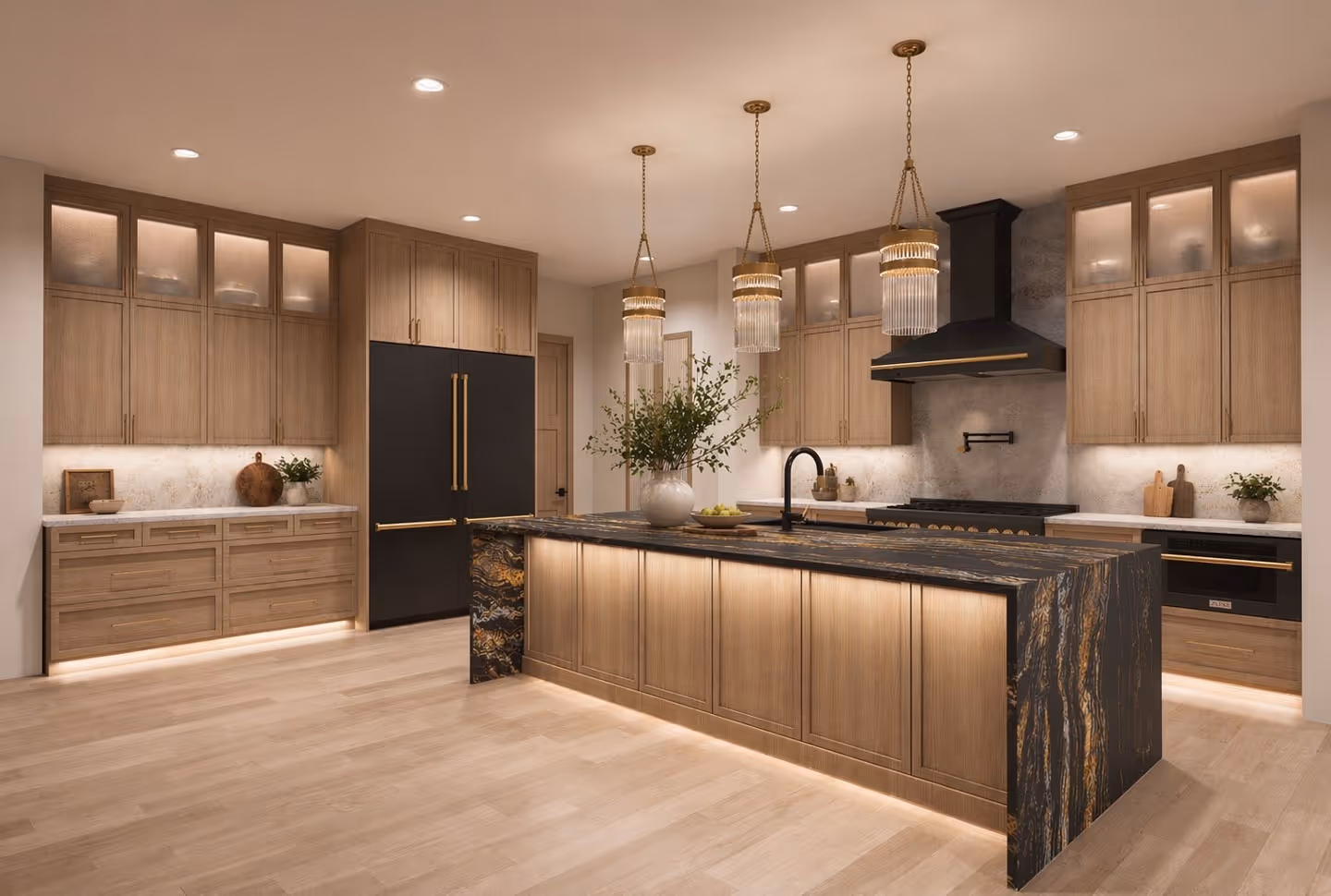 Modern kitchen with gray cabinets, marble countertops, island with bar stools, built-in ovens, and gray tile flooring.